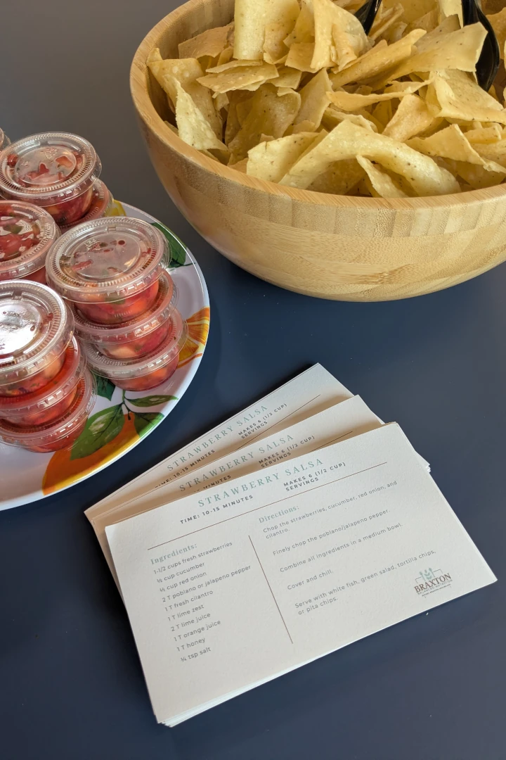 Take-home recipe cards displayed on a table from a workplace wellness session